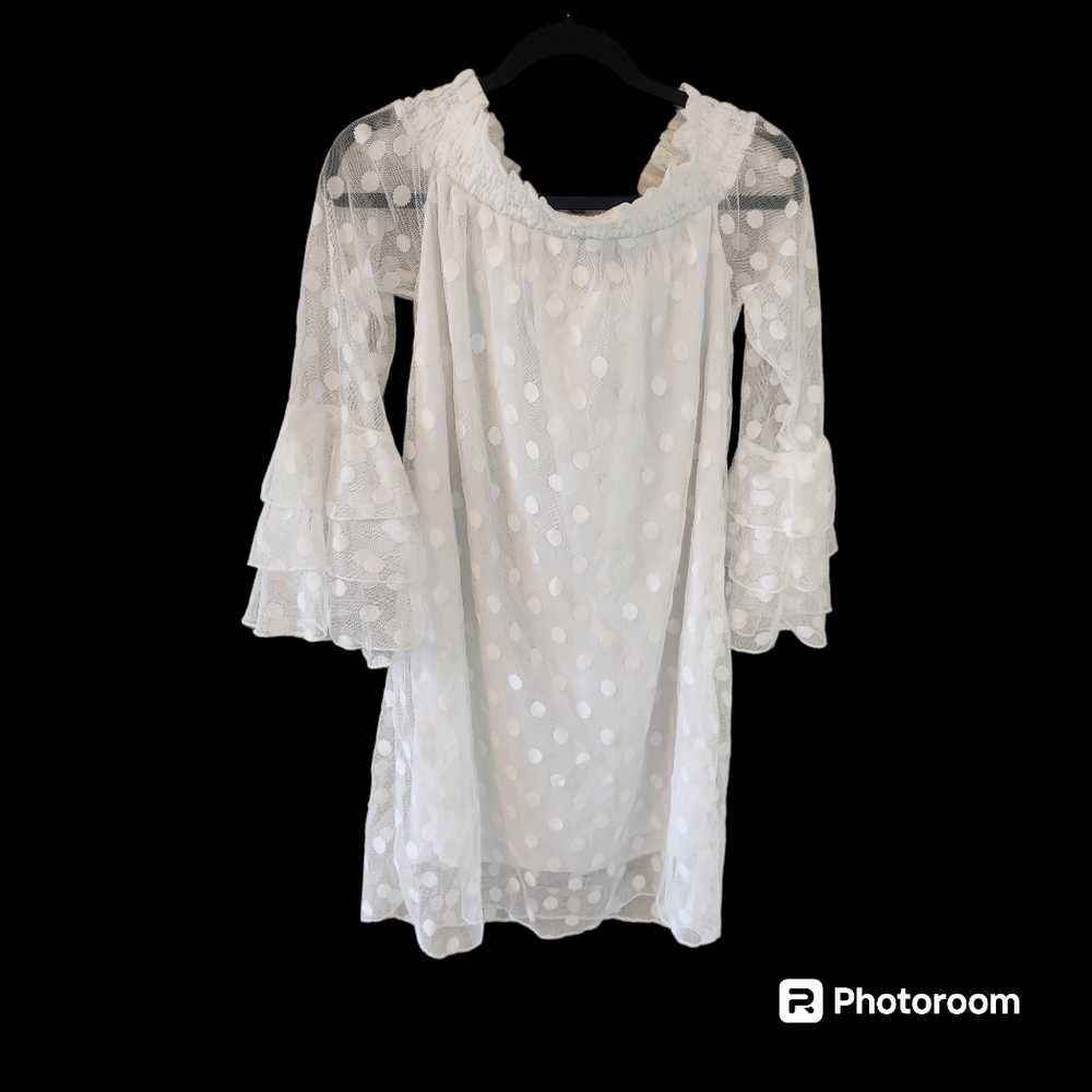 White polka dot bell sleeve dress. Stretchy collar that can be worn off shoulder